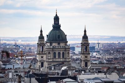 View of buildings in city against sky