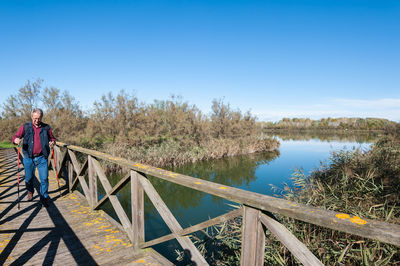 Scenic view of footbridge against clear sky