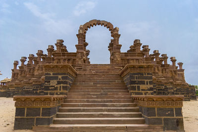Low angle view of old temple against sky
