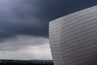 Low angle view of modern buildings against sky