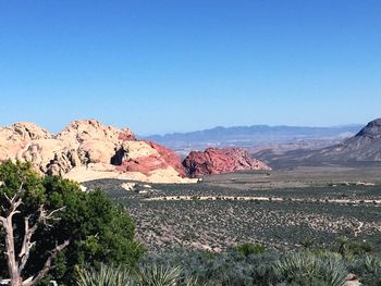 Scenic view of landscape against clear blue sky