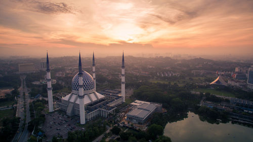 Aerial view of city at sunset