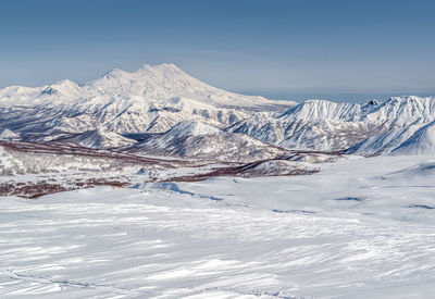 Scenic view of snowcapped mountains against sky