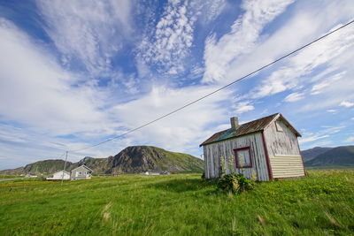 House on field against sky