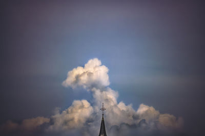 Low angle view of statue against cloudy sky