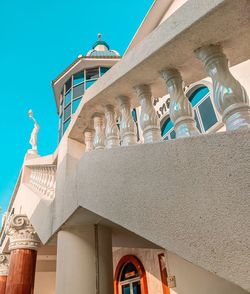 Low angle view of building against clear blue sky