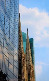Low angle view of modern buildings against sky