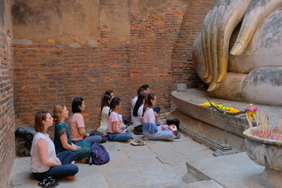 Group of people sitting outdoors