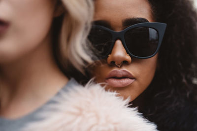 Close-up portrait of woman wearing sunglasses