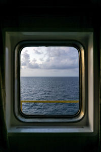 Scenic view of sea seen through window