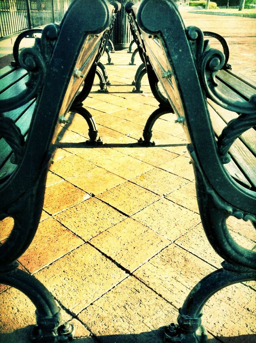 bicycle, transportation, land vehicle, mode of transport, stationary, parked, wheel, parking, sunlight, shadow, part of, high angle view, absence, street, metal, cropped, parking lot, travel, no people, day