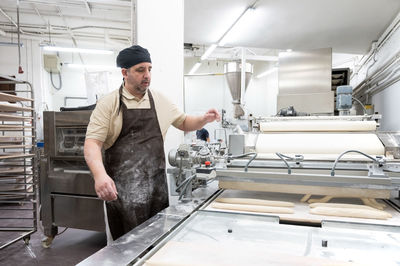 Portrait of young man working in workshop