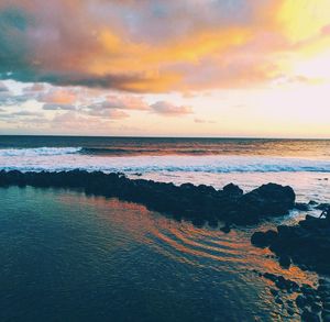 Scenic view of sea against sky during sunset