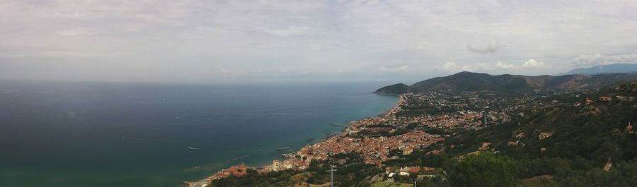 Scenic view of sea against cloudy sky