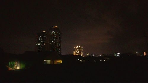 Illuminated cityscape at night