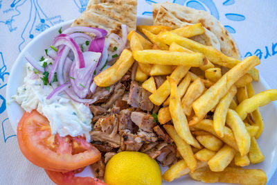 Close-up of burger and fries on plate