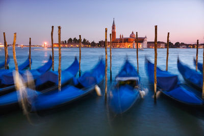 Boats moored in canal
