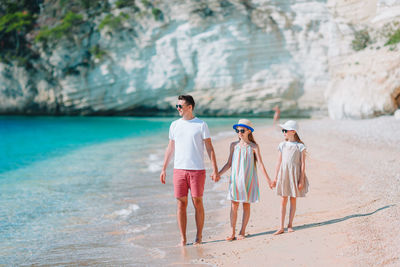 Women standing on beach