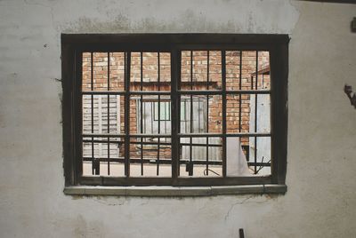 Brick wall seen through window