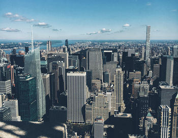 High angle view of modern buildings in city against sky