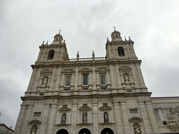 Low angle view of historic church against sky