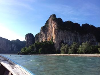 Rock formations in sea against sky