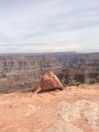 Rocks on desert against sky