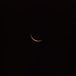 Low angle view of moon against sky at night