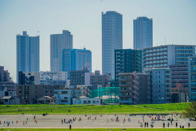 Skyscrapers in city against sky