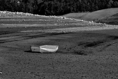 Abandoned chair on field