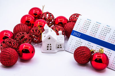 Close-up of christmas decorations on white background