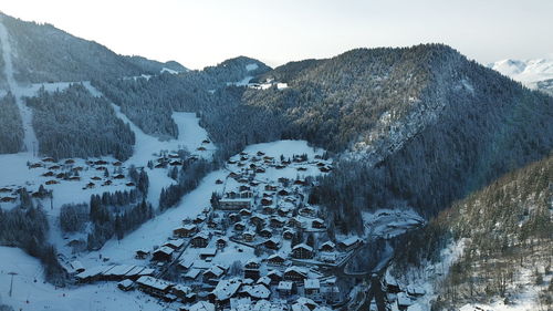 Scenic view of snow covered mountains against sky