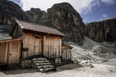 Built structure on mountain against sky