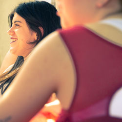 Close-up portrait of a smiling young woman