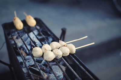 High angle view of eggs on barbecue grill