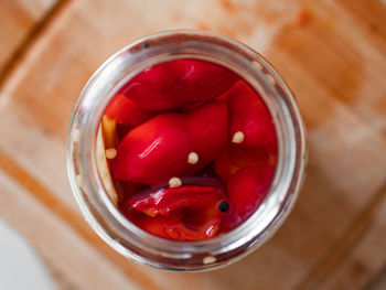 Close up of pickled peppers in jar