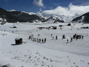 Group of people on snow covered mountains