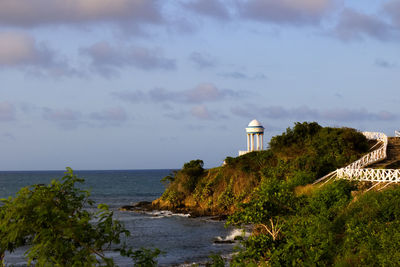 Scenic view of sea and buildings against sky