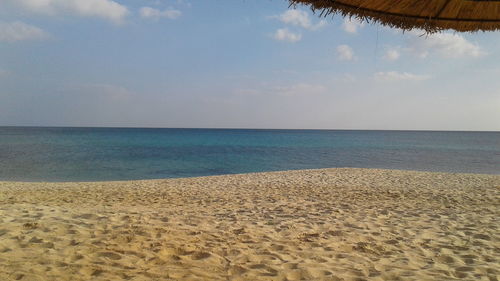 Scenic view of beach against sky