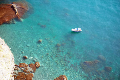 Aerial view of sailboat moored on sea