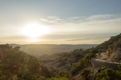 Scenic view of landscape against cloudy sky