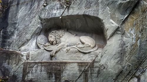 Statue on stone wall