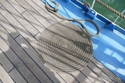 High angle view of rope arranged on boat