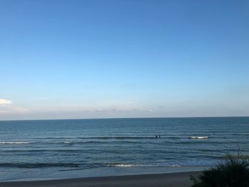 Scenic view of sea against clear blue sky