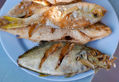 High angle view of fish in plate on table