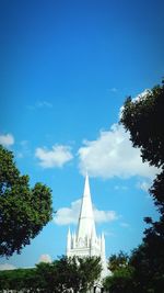 Low angle view of building against blue sky