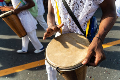 Members of a percussion group are seen playing during fuzue, pre-carnival 