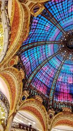 Low angle view of multi colored ceiling of building