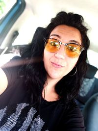 Portrait of mature man sitting in car