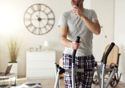 Full length of man using mobile phone